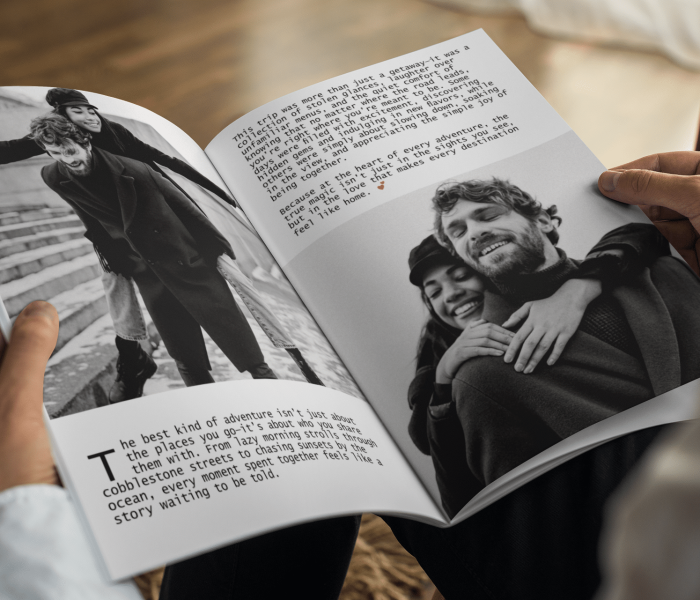 Hands holding an open custom photo book featuring black-and-white images of a couple and a heartfelt story, capturing the essence of personalized storytelling.